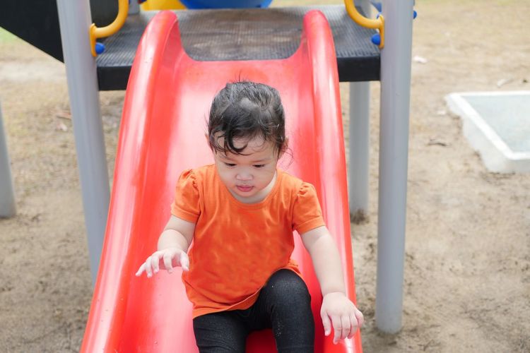 Full length of boy playing at playground