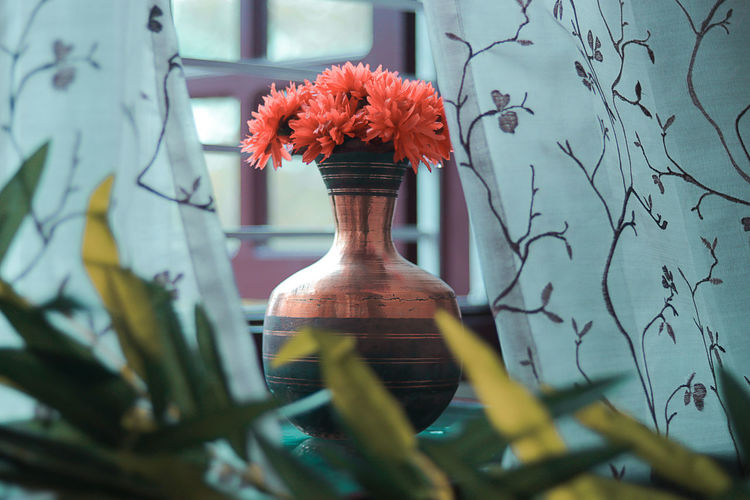 Close-up of red flower pot on table