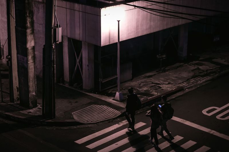 People walking on staircase in city
