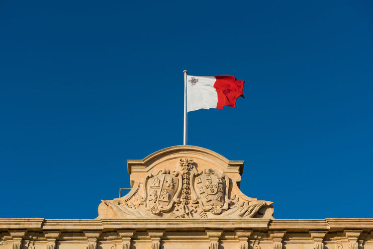 Low angle view of building against clear blue sky