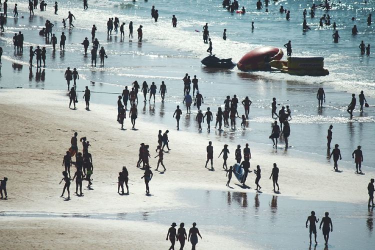 High angle view of people on frozen water