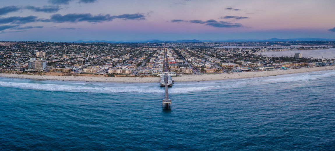 Panorama crystal pier pacific beach san diego sunrise aerial.