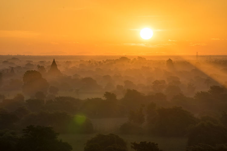 Scenic view of landscape against sky during sunset