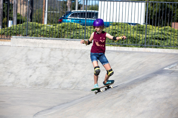 Full length of boy riding skateboarding on skateboard