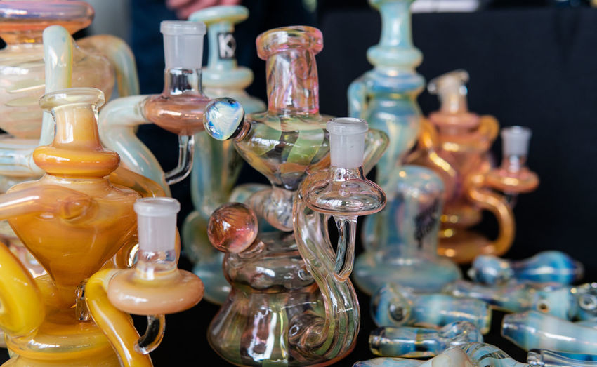 Close-up of colorful bongs on table