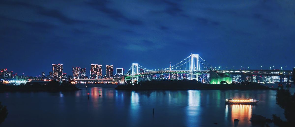 Illuminated city at waterfront