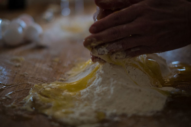 Close-up of person preparing dough