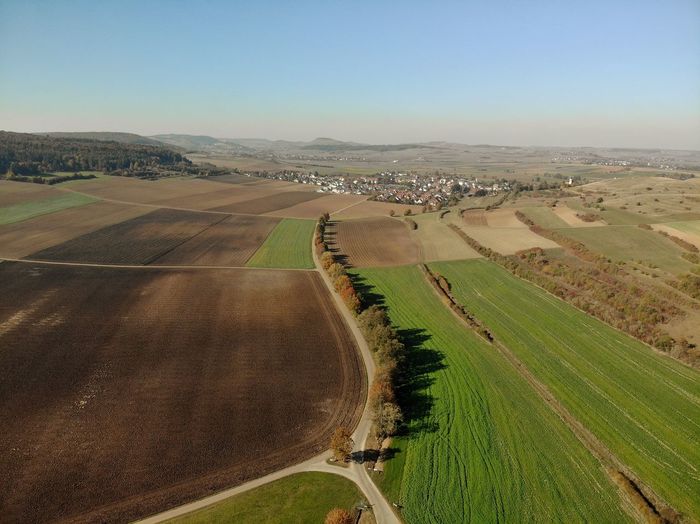 Aerial view of agricultural field against sky