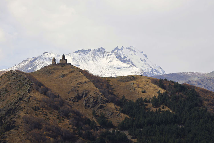 Scenic view of snowcapped mountains against sky