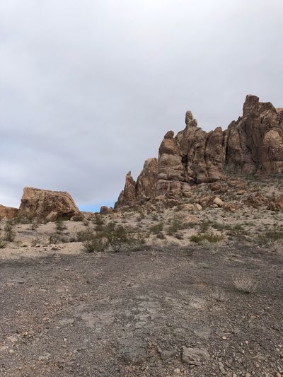 Rock formations on landscape against sky