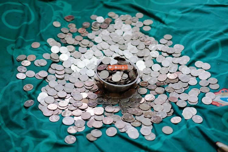 High angle view of coins on floor
