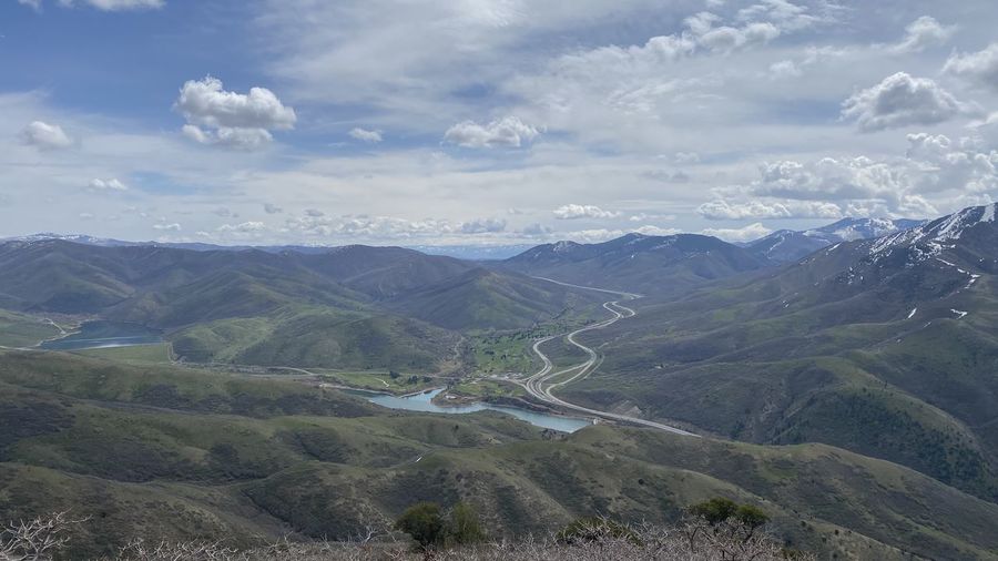 High angle view of valley and mountains against sky