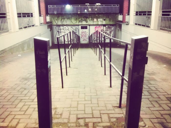Empty walkway in city