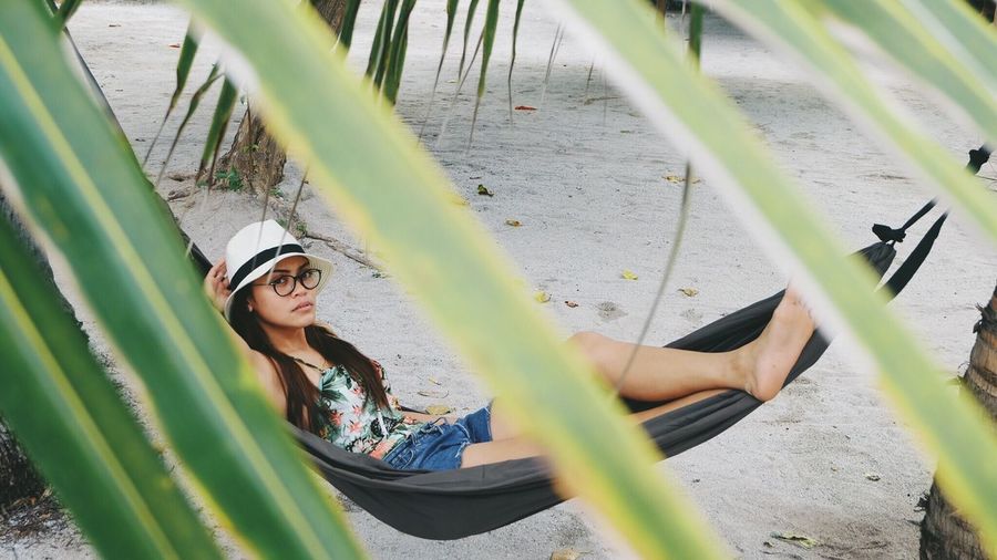 High angle view of young woman in hammock