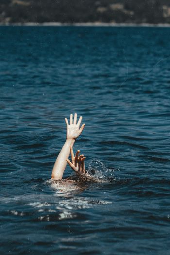 Person drowning in sea