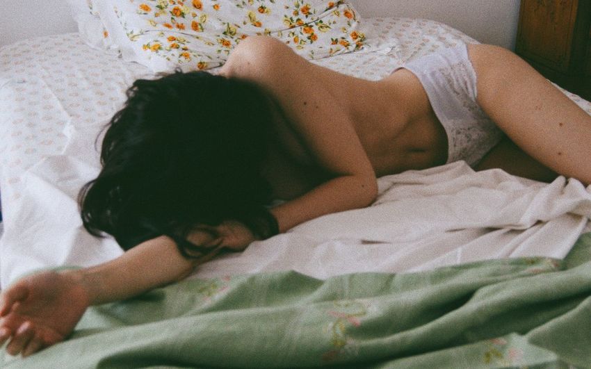 High angle view of baby sleeping on bed at home