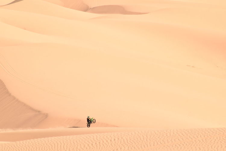 Man riding motorcycle on desert