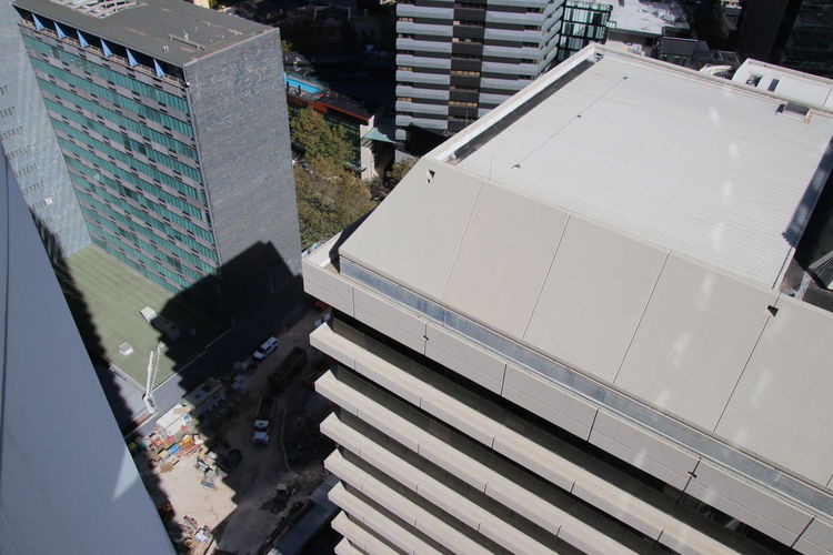 High angle view of buildings by street in city