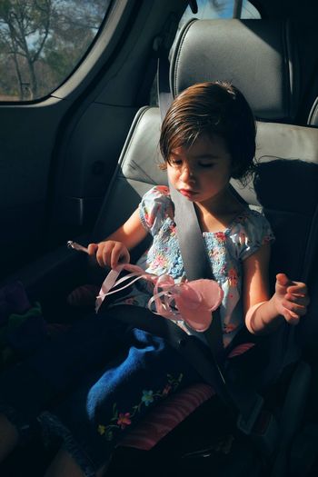 Child sitting in car