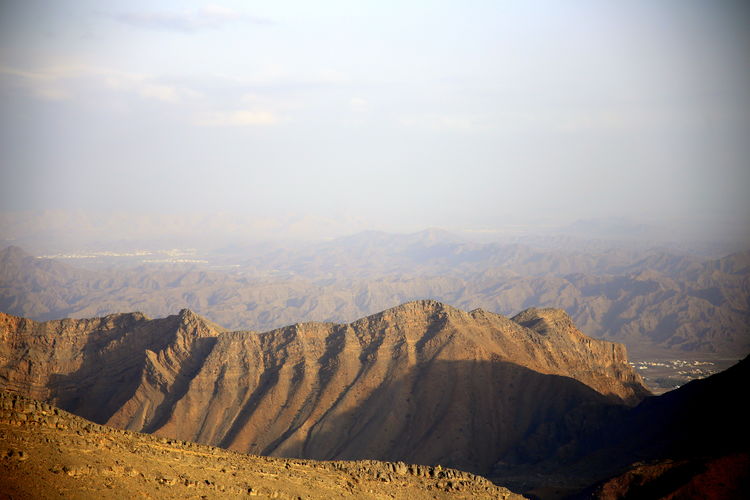 View of the plain below in the pass between the mountain peaks, jabal akhdar, towards nizwa, oman