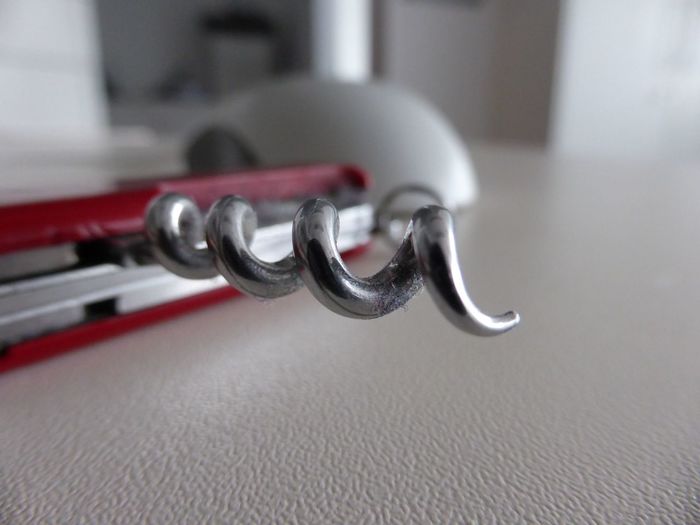 Close-up of corkscrew on table