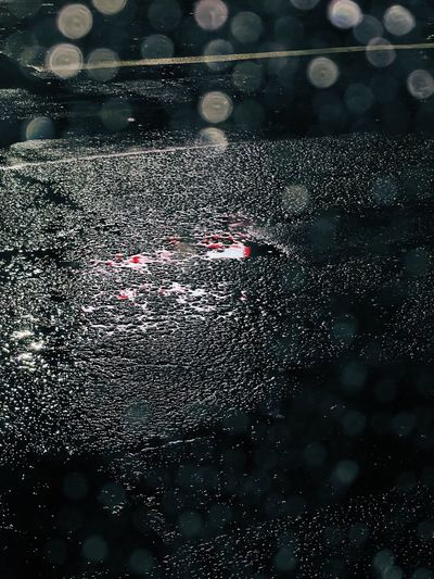Wet car on street during rainy season