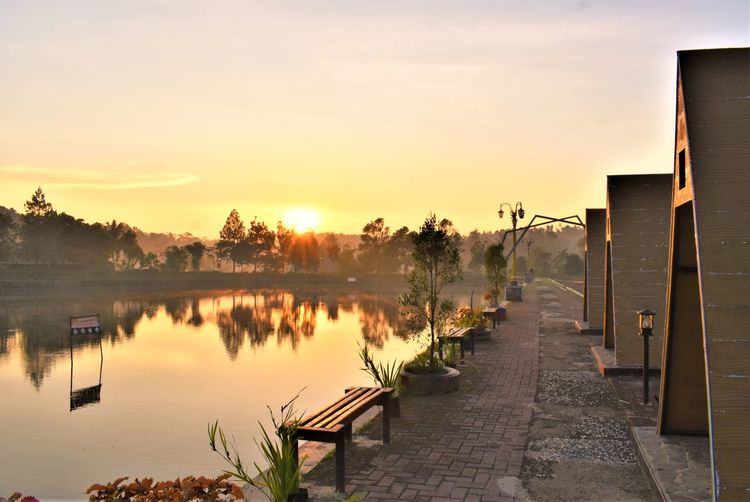 Scenic view of lake against sky during sunset