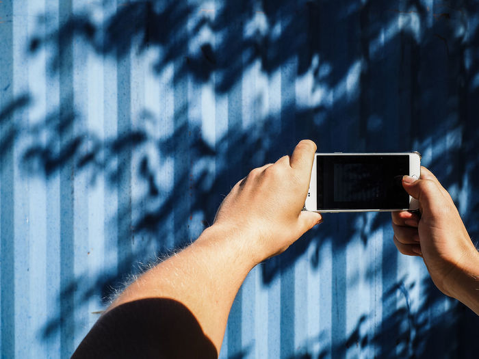 Young woman holding smart phone