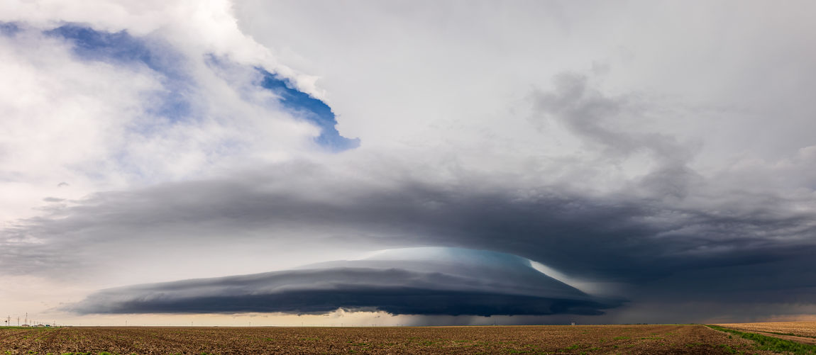 Panoramic view of a dramatic supercell thunderstorm near colby, kansas.