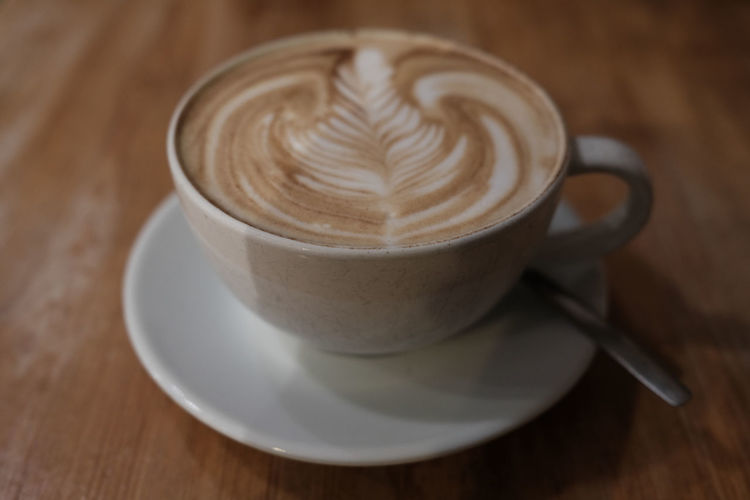 Close-up of cappuccino on table