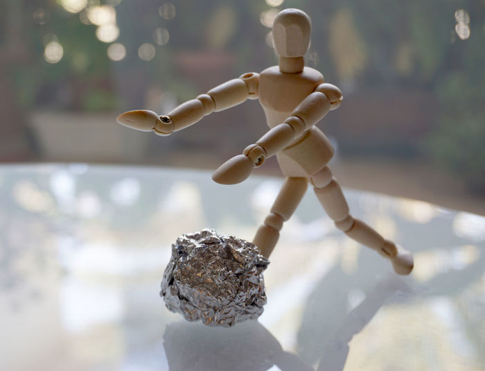 Close-up of stuffed toy on wood