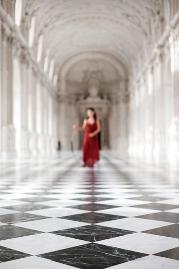 Full length of woman walking in corridor of building