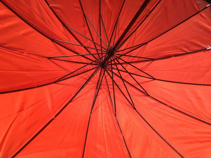 Low angle view of red umbrella