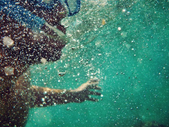 Person swimming underwater