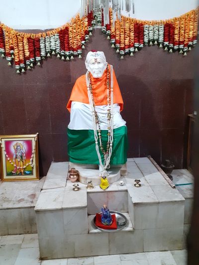 Midsection of man standing in temple