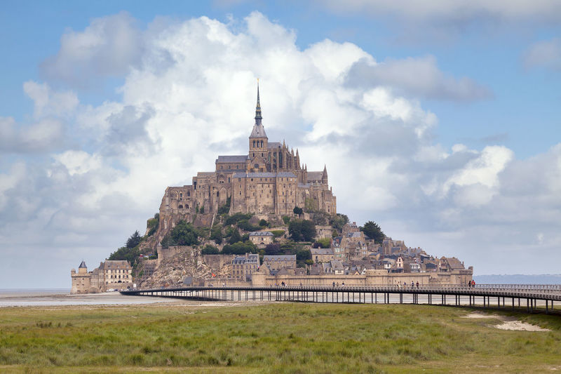 The mont saint-michel is a tidal island and mainland commune in normandy, france.