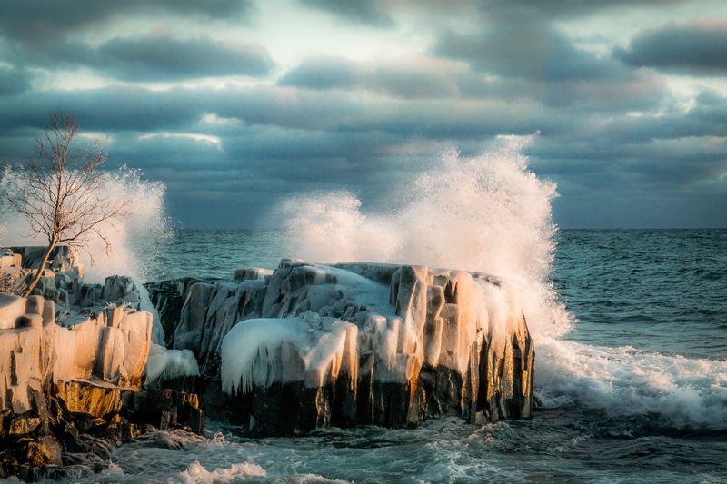 Waves breaking on rocks at coast