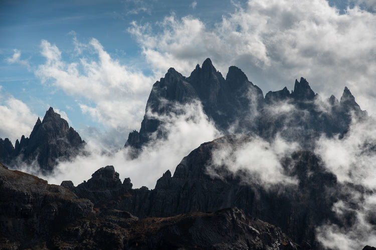 Mountain peaks covered with clouds at tre cime di lavaredo area in italy
