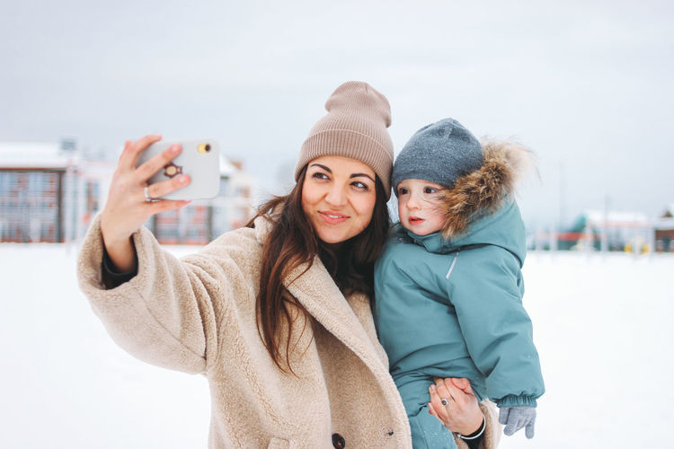 Portrait of a smiling young woman in winter