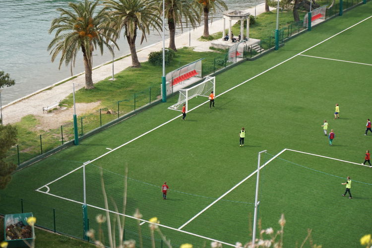 High angle view of people playing soccer field