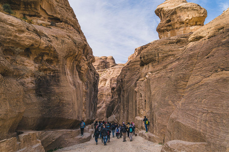 Group of people walking in a canyon