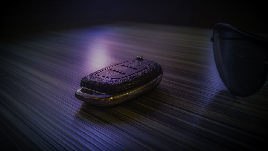 Close-up of car key on table