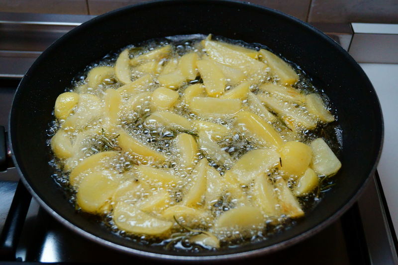 Close-up of potato cooking in pan