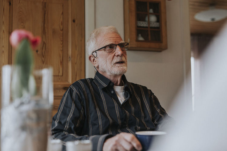 Senior man having coffee
