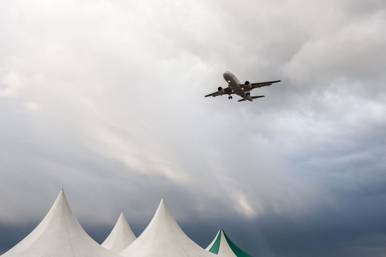 Low angle view of airplane flying in sky