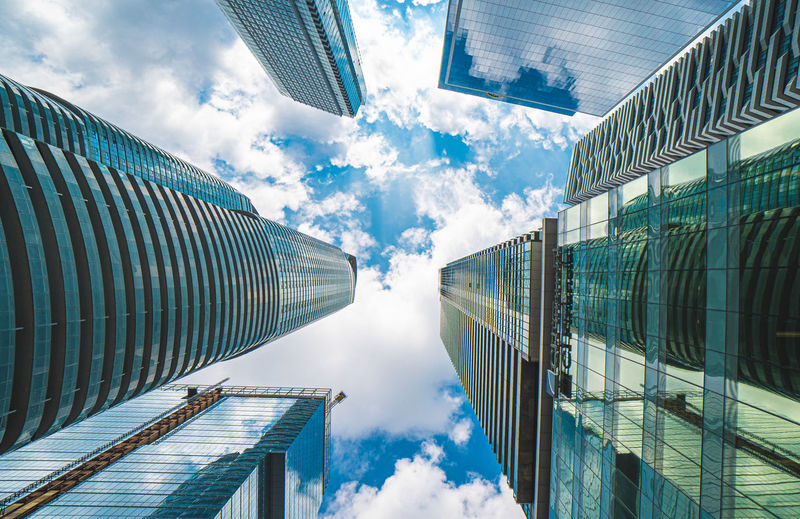 Directly below shot of modern buildings against sky