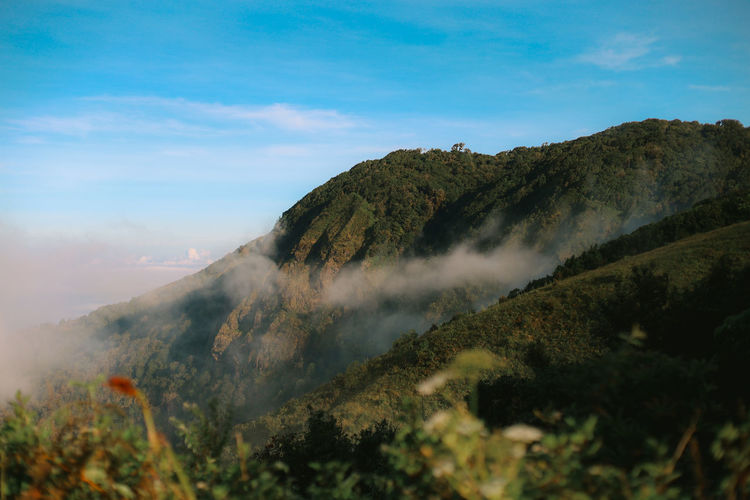 Scenic view of volcanic mountain against sky