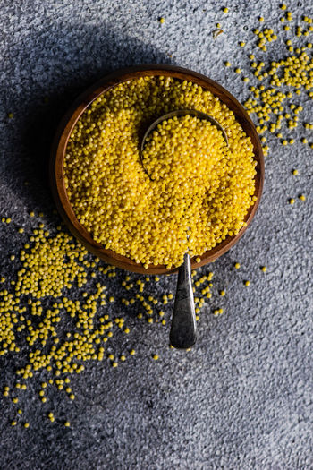 High angle view of mustard seeds in container