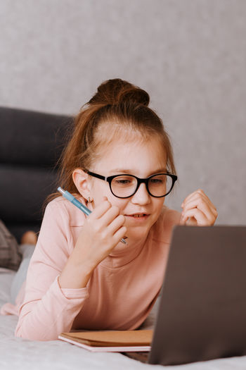 Young woman using laptop at home