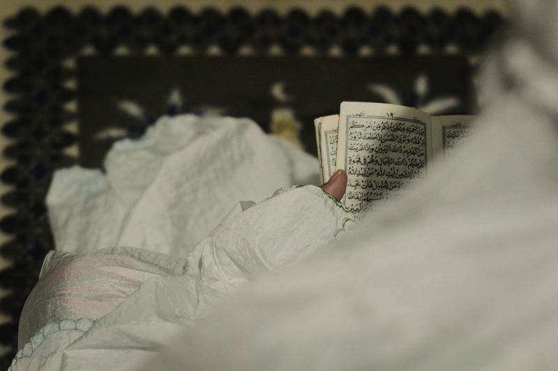 Close-up of person reading book